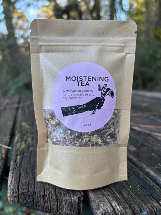 A small kraft paper pouch of Moistening Tea, a demulcent cold infusion made with marshmallow root, cinnamon, and hibiscus